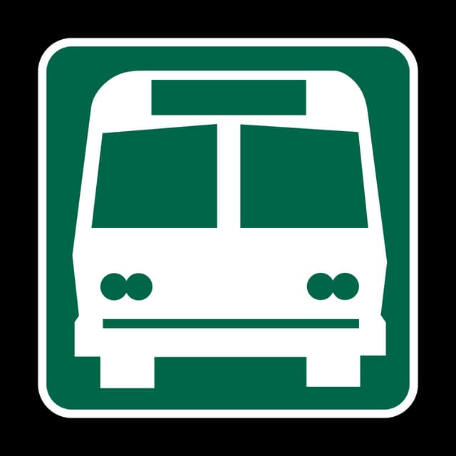 Bus Station sign - Marks the location or direction of a bus terminal or major bus stop where passengers can board or transfer.