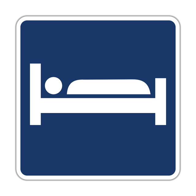 Lodging sign - Alerts drivers to nearby hotels, motels, or other lodging options accessible from the route.
