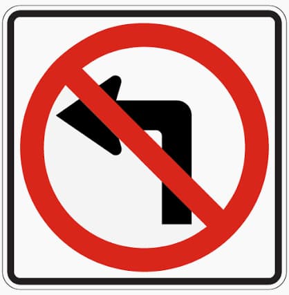 No Left Turn sign - Left turns are not allowed here; follow the roadway or choose another route.