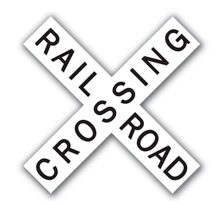 Rail Road Crossbuck sign - Marks a railroad crossing; look both ways, listen, and be prepared to stop for trains.