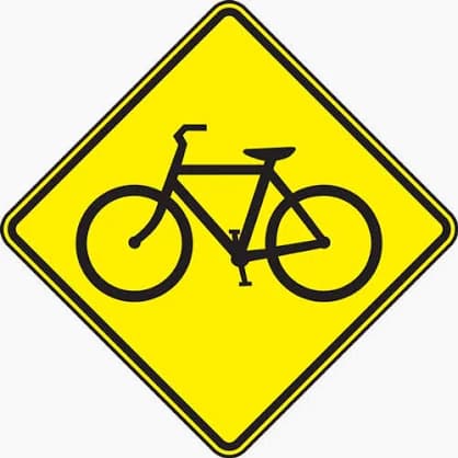 Bicycle Crossing sign - Warns that cyclists frequently cross or share the roadway at this point; slow and watch for bikes.