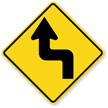 Left Reverse Turn sign - Shows a sharp turn followed by a reverse turn to the opposite side, starting to the left.