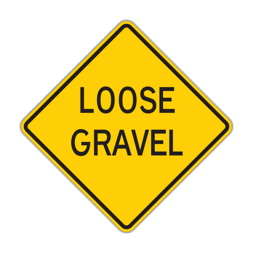 Loose Gravel sign - Warns of loose stones on the road surface that can reduce traction and cause flying debris.