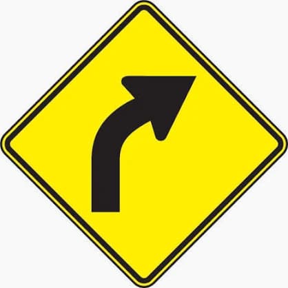 Right Curve sign - Indicates a gradual right curve ahead; reduce speed as necessary.