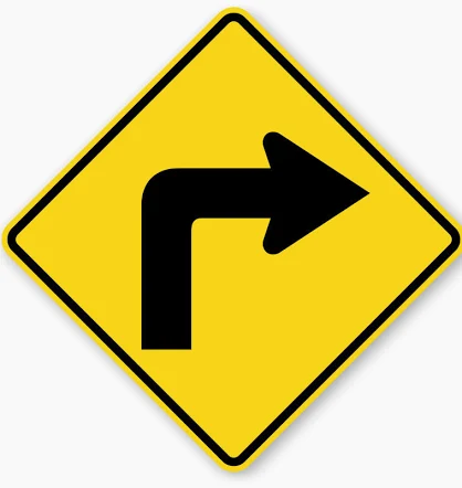Sharp Right Turn sign - Indicates a sharp right turn where a significant speed reduction is needed.