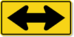 Two Direction Arrow sign - Shows that traffic can proceed in two opposite directions from this point, usually after a median ends.
